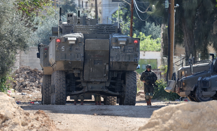 epa11930325 A view of Israeli troops during a military operation inside the Jenin refugee camp, West Bank, 28 February 2025. The Israeli military launched a military operation in Jenin and its camp on 21 January, resulting in at least 27 Palestinian deaths and dozens of injuries, according to the Palestinian Ministry of Health. EPA/ALAA BADARNEH