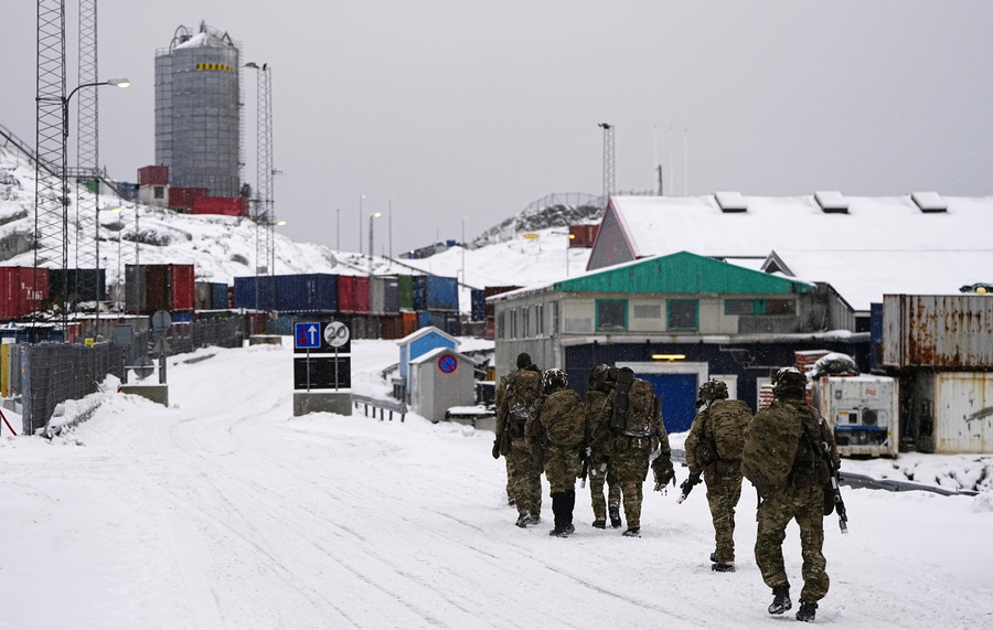 epa12659168 Danish soldiers walk on a street after disembarking at the port in Nuuk, Greenland, 18 January 026. The Danish Defense will continue the increased presence with exercise activities together with a number of NATO allies in and around Greenland in 2026. This is done in cooperation with the Greenlandic authorities and the Greenlandic government, Naalakkersuisut, as stated on the Danish Defense website. EPA/Mads Claus Rasmussen DENMARK OUT