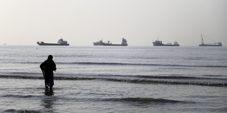 epa13009259 A handout photo made available by Isna News Agency shows an Iranian woman watching cargo ships stuck in the Strait of Hormuz, along the coast of Bandar Abbas, in southern Iran, 01 June 2026. According to Iranian state media, the military's central command warned all vessels to secure Islamic Revolution Guards Corps (IRGC) Navy clearance to pass through the strait or face maritime security risks.  EPA/AMIRHOSSEIN KHORGOOEI/ ISNA NEWS AGENCY HANDOUT RESTRICTIONS: NO Access Israel Media/Persian Language TV Stations Outside Iran/Strictly No Access BBC Persian/VOA Persian/Manoto TV/Iran International TV. (As mandated by Iran's Directorate General for Foreign Media) -- HANDOUT EDITORIAL USE ONLY/NO SALES